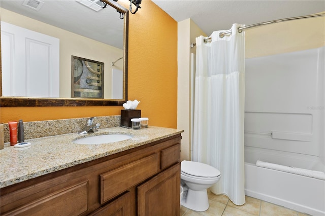 bathroom featuring shower / tub combo with curtain, visible vents, toilet, vanity, and tile patterned flooring