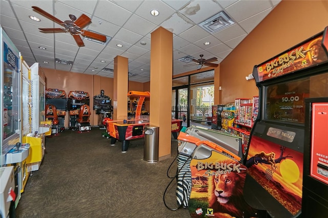 playroom with ceiling fan, visible vents, and a paneled ceiling