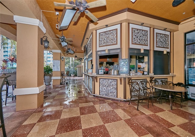 interior space with high vaulted ceiling, ornamental molding, and a ceiling fan