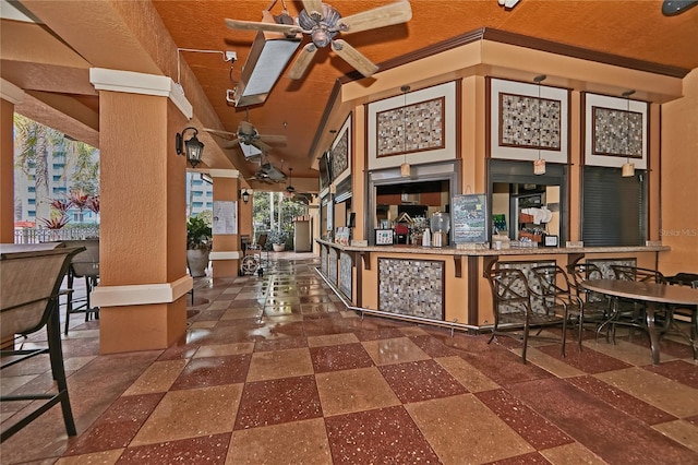 interior space with ceiling fan