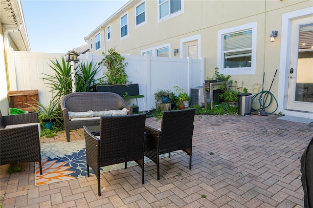 7407 Ripplepointe Way, Windermere, FL 34786 - view of patio featuring outdoor dining space and central AC unit