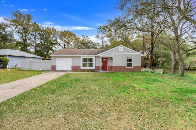 single story home with driveway, a garage, a front yard, and brick siding