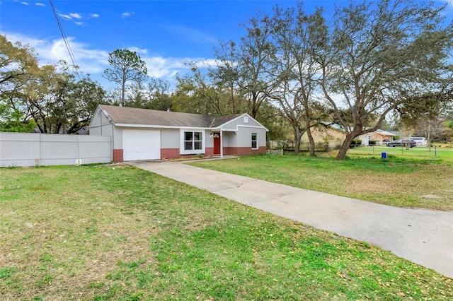 view of front of property with a garage, driveway, brick siding, and fence