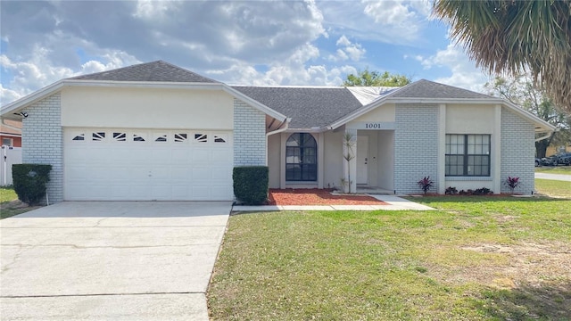 single story home featuring a garage, brick siding, a shingled roof, concrete driveway, and a front lawn