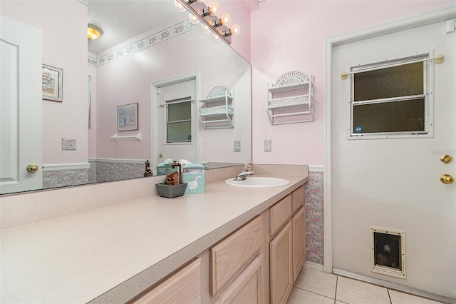 bathroom with tile patterned floors and vanity