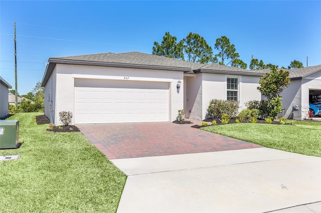 ranch-style house featuring stucco siding, a front lawn, decorative driveway, a shingled roof, and a garage