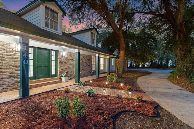 view of side of property with brick siding