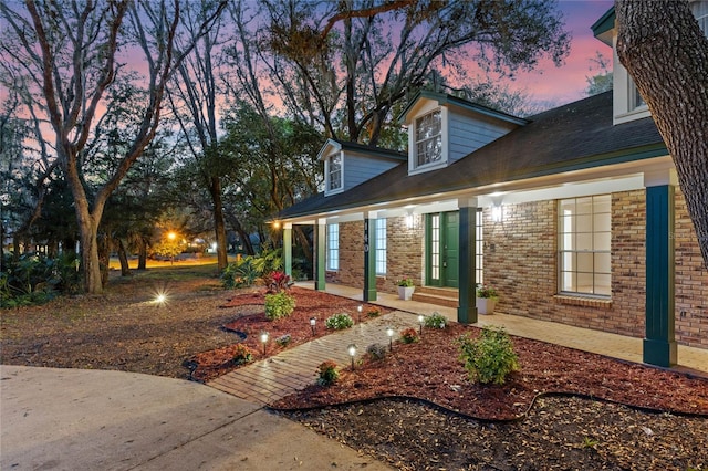 exterior space with brick siding