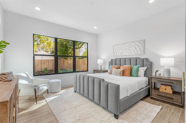 bedroom featuring recessed lighting and light wood-type flooring