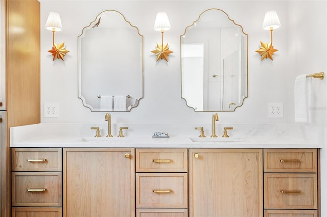 bathroom with double vanity and a sink