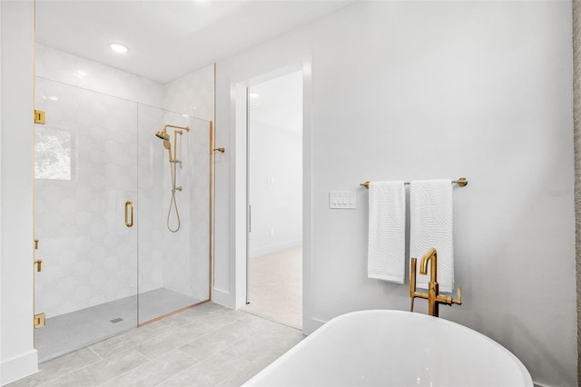 full bathroom featuring a shower stall, recessed lighting, and a freestanding bath