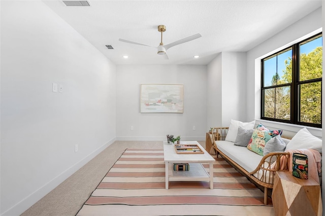 living room with visible vents, light carpet, recessed lighting, baseboards, and ceiling fan