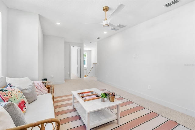 living room featuring visible vents, baseboards, light carpet, recessed lighting, and a ceiling fan