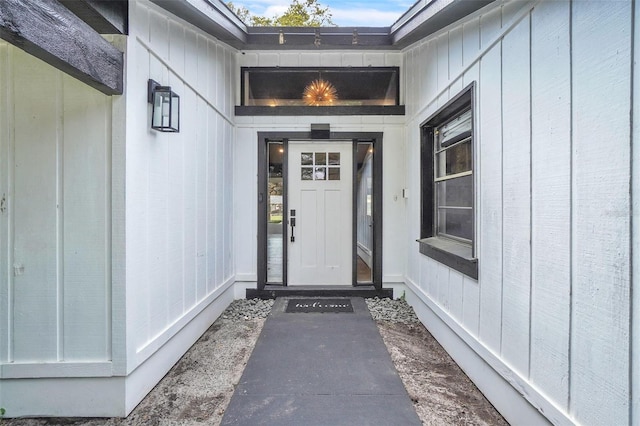 doorway to property with board and batten siding