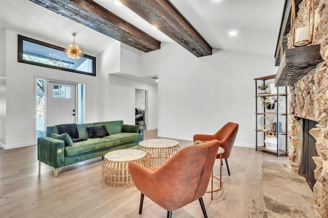 living room featuring beamed ceiling, light wood-style flooring, high vaulted ceiling, and baseboards