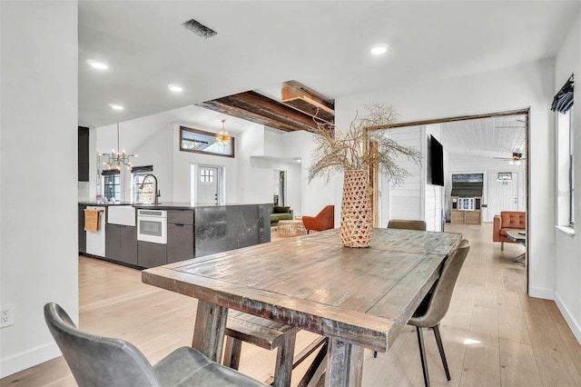 dining area featuring visible vents, baseboards, recessed lighting, light wood-style floors, and ceiling fan with notable chandelier