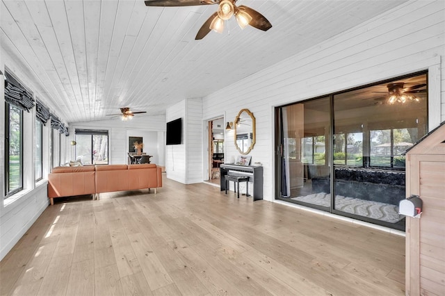 interior space featuring wood ceiling, a ceiling fan, and vaulted ceiling