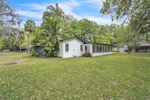 view of yard featuring a sunroom