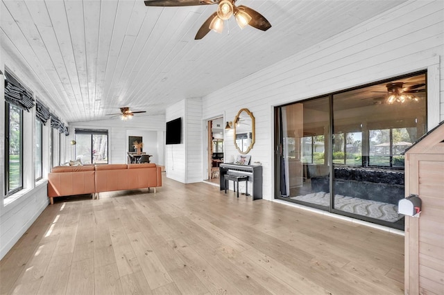 sunroom / solarium with a ceiling fan and plenty of natural light