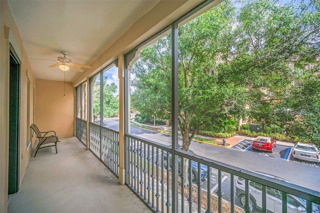 exterior space with ceiling fan