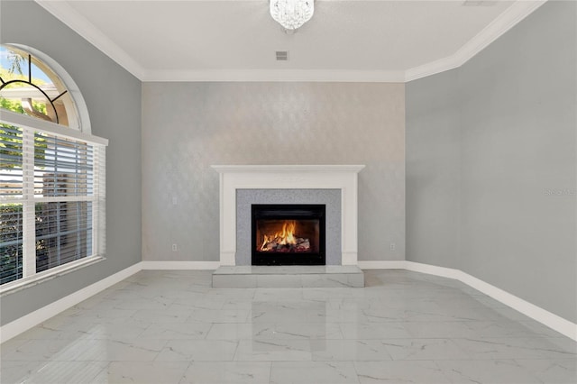 unfurnished living room with a warm lit fireplace, marble finish floor, ornamental molding, and baseboards