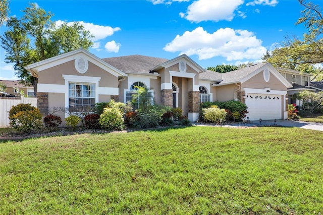 view of front of house featuring stucco siding, concrete driveway, a front yard, a garage, and stone siding