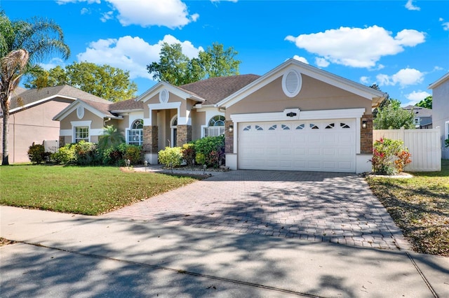 view of front of home with a garage, stone siding, decorative driveway, and stucco siding