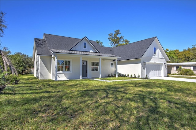 modern inspired farmhouse featuring a standing seam roof, metal roof, a front lawn, and concrete driveway