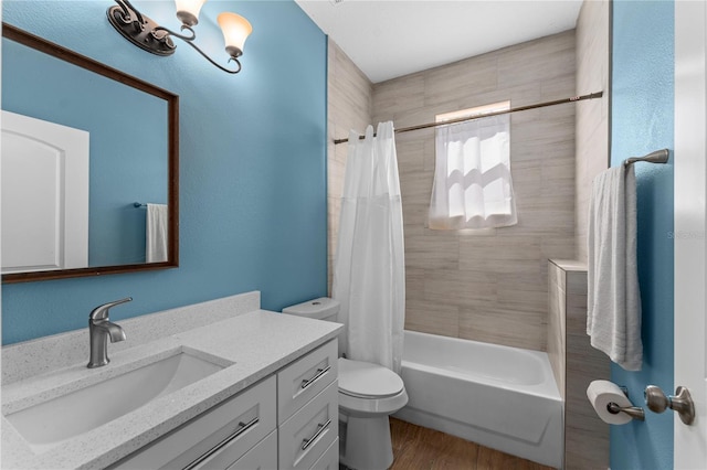 bathroom with toilet, shower / tub combo, wood finished floors, and vanity