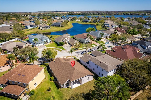 birds eye view of property with a residential view and a water view