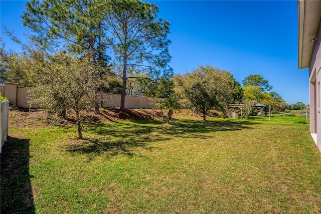 view of yard featuring fence