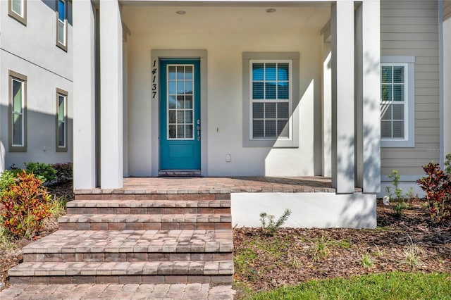 doorway to property with a porch