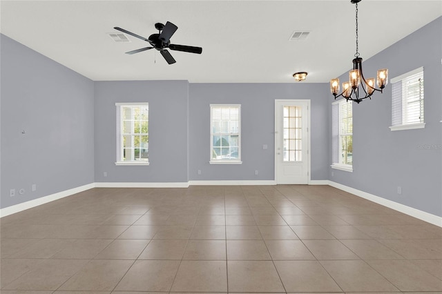 spare room with visible vents, baseboards, and a healthy amount of sunlight