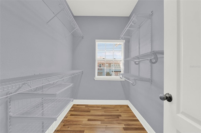 spacious closet with wood finished floors