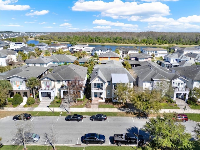 birds eye view of property featuring a residential view and a water view