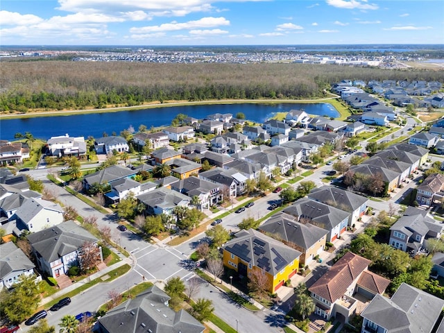 birds eye view of property with a residential view and a water view