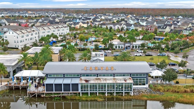 aerial view with a residential view and a water view