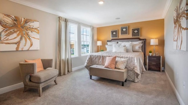 bedroom with ornamental molding, carpet floors, and baseboards