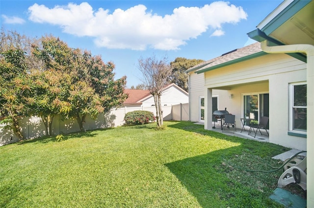 view of yard with a patio area and a fenced backyard