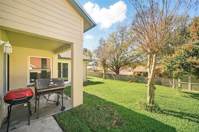 view of yard with a patio area and fence