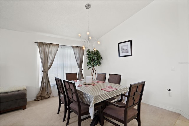 dining room with lofted ceiling, a textured ceiling, baseboards, light colored carpet, and a chandelier