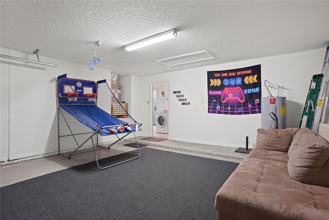 game room with attic access, washer / clothes dryer, a textured ceiling, carpet flooring, and electric water heater