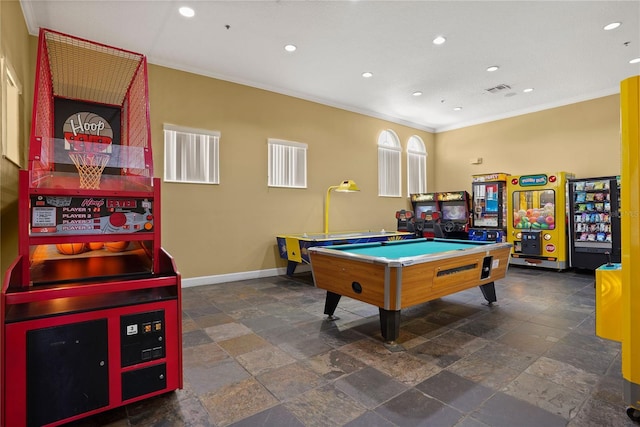 recreation room with visible vents, baseboards, ornamental molding, recessed lighting, and stone finish floor