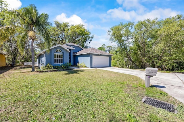 ranch-style house featuring a garage, stucco siding, concrete driveway, and a front yard