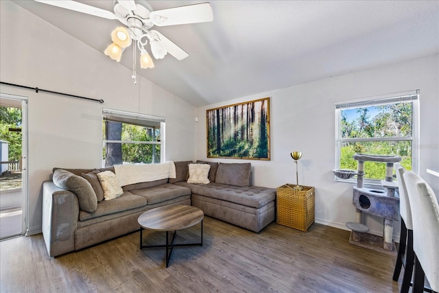 living room with lofted ceiling, plenty of natural light, ceiling fan, and wood finished floors