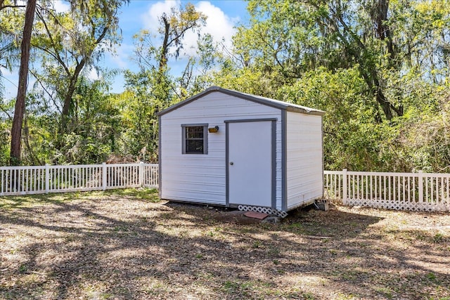 view of shed featuring a fenced backyard