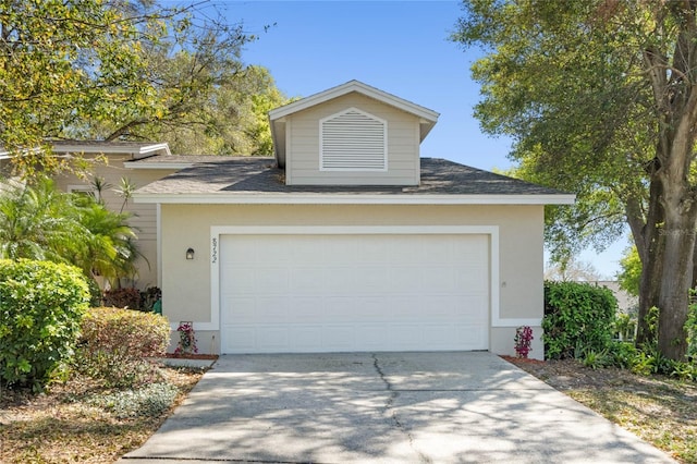 exterior space with concrete driveway