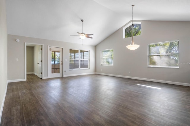 unfurnished room with high vaulted ceiling, dark wood-type flooring, a ceiling fan, and baseboards