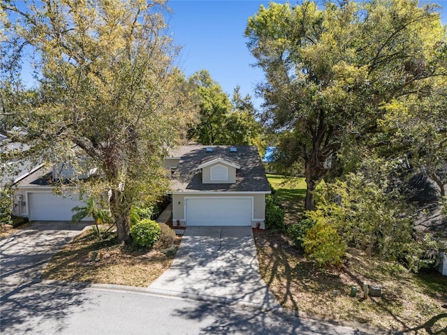 view of front of home with an attached garage and concrete driveway