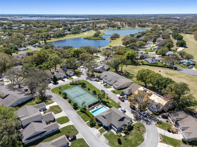 birds eye view of property with a residential view and a water view